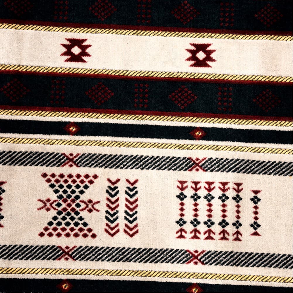 Alsanidi, a floor seating mat for trips, camping, and desert outings, padded with sponge, traditional rug, wooden *oudi.