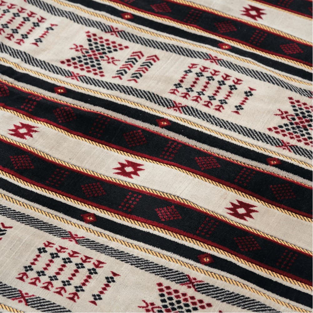 Alsanidi, a floor seating mat for trips, camping, and desert outings, padded with sponge, traditional rug, wooden *oudi.
