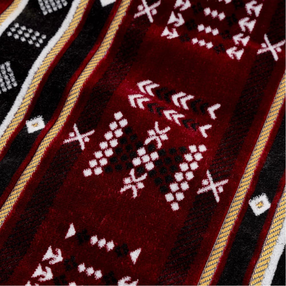 Alsanidi, a floor seating mat for trips, camping, and desert outings, padded with sponge, traditional rug, wooden *oudi.