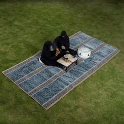 Alsanidi, a floor seating mat for trips, camping, and desert outings, padded with sponge, traditional rug, wooden *oudi.