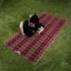 Alsanidi, a floor seating mat for trips, camping, and desert outings, padded with sponge, traditional rug, wooden *oudi.
