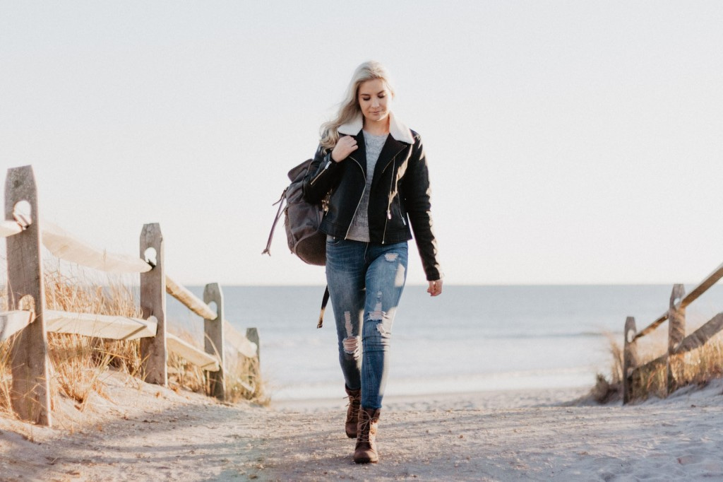 woman walking in leather jacket