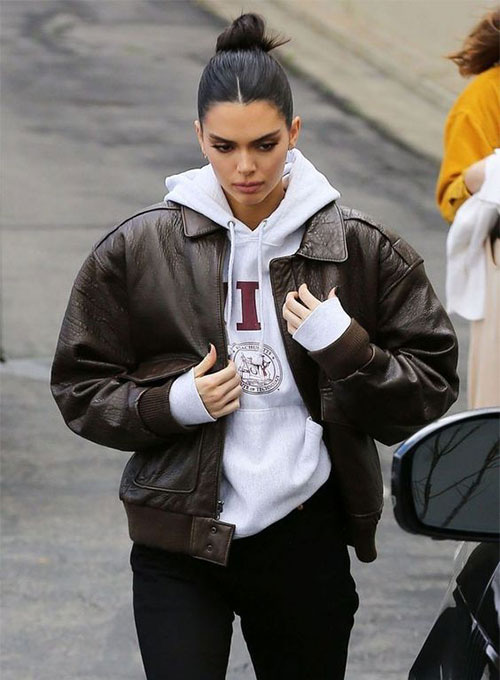 Kendall Jenner: Orange Jacket, Black Leggings